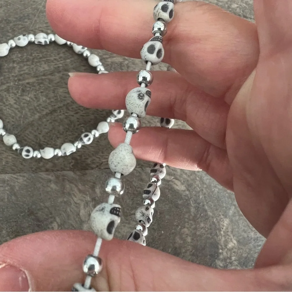 Skull face and silver tone bead stretch bracelet set